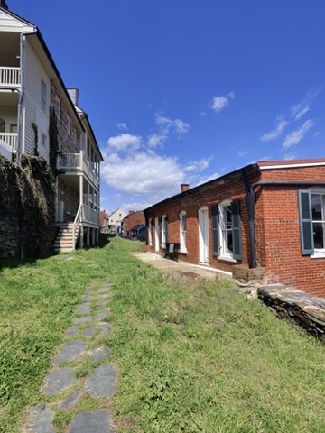 Narrow stone path between historic buildings in Harpers Ferry