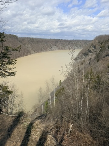 Wide river bend through forested hills on the drive home
