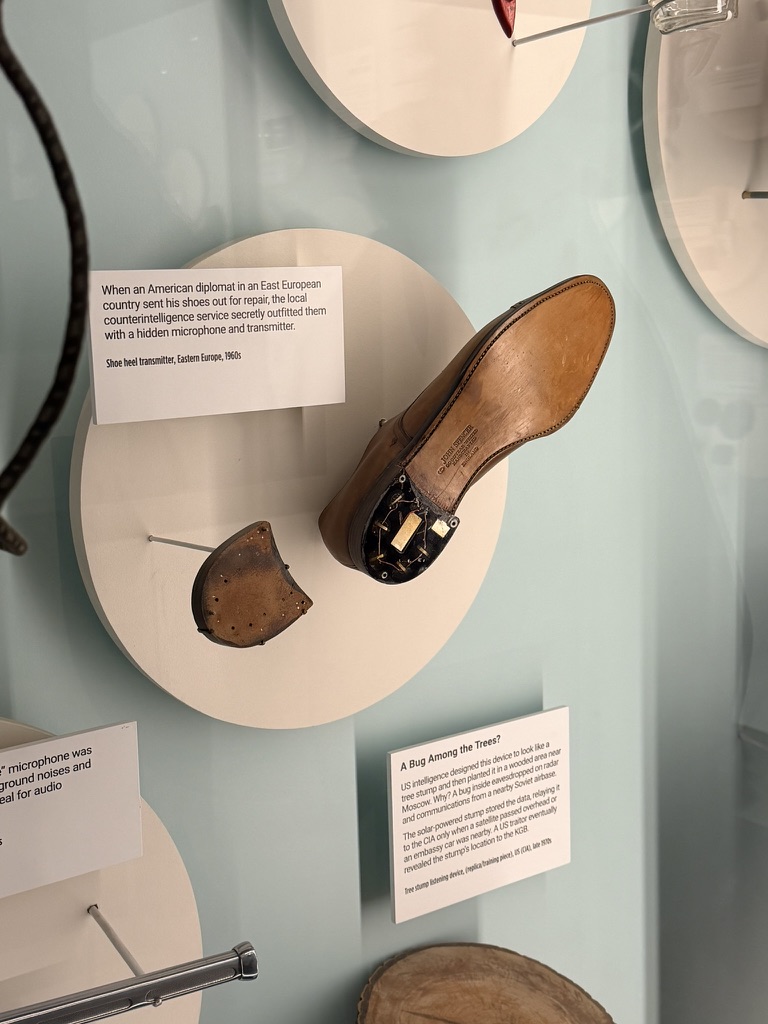 Spy Museum exhibit showing a shoe heel transmitter used by Eastern European counterintelligence in the 1960s
